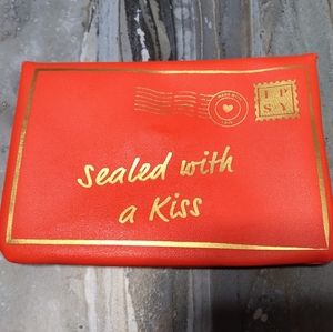 Ipsy cosmetic bag sealed with a kiss